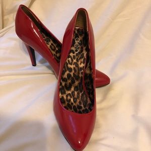 Red patent leather pump by Deb
